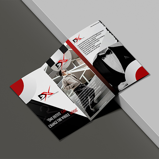 A mockup of a tri-fold brochure for DX Men's Store with the DX logo, fashionable men's clothing, and the slogan "One outfit can change the whole mood" displayed on a gray and white background. Digital Marketer